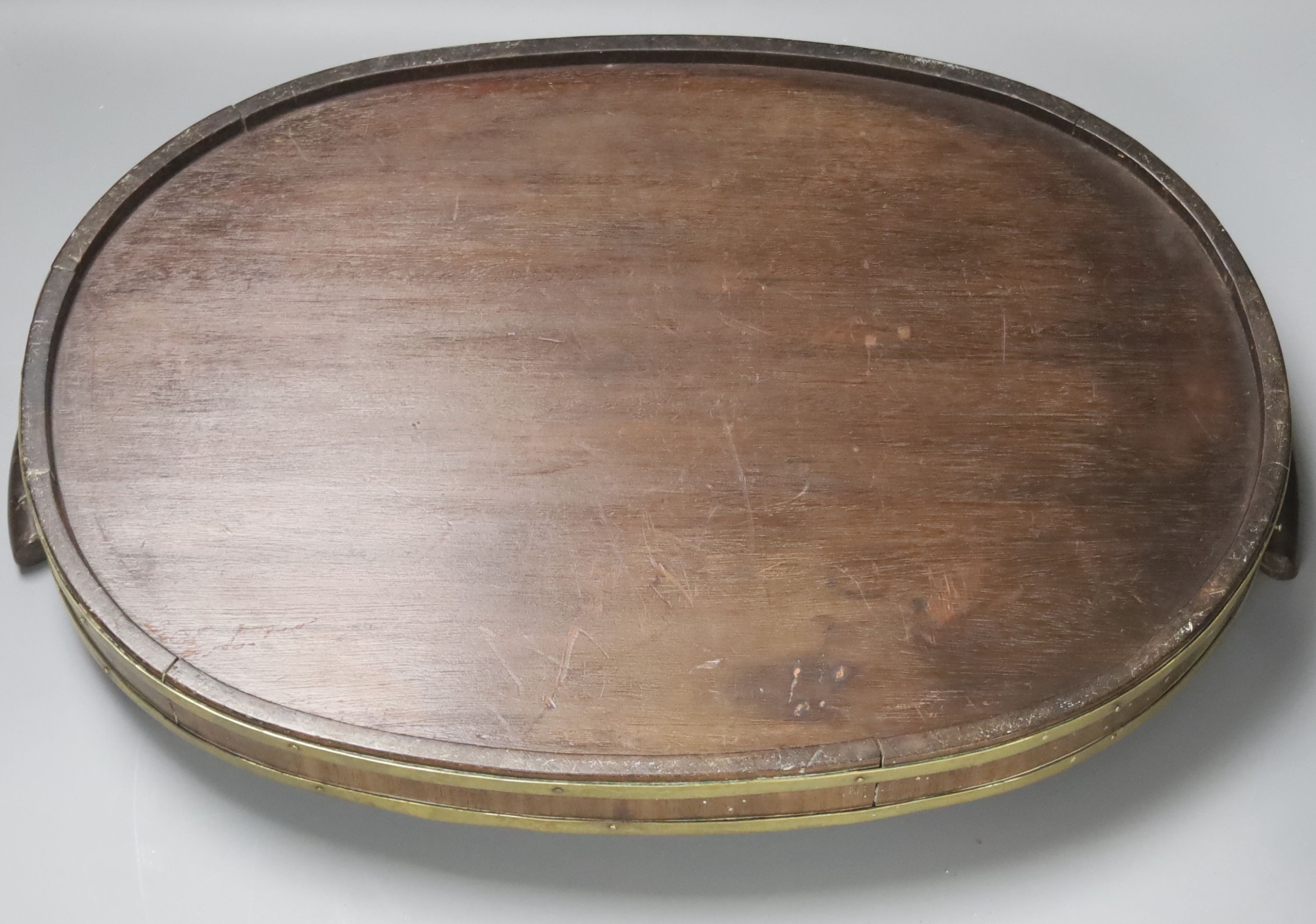 A George III brass bound oval tray and a small Victorian oak oak tray 52cm
